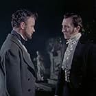 Peter Cushing and Robert Urquhart in The Curse of Frankenstein (1957)