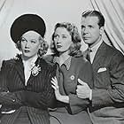 Joan Blondell, Gloria Dickson, and Dick Powell in I Want a Divorce (1940)