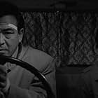 Michitarô Mizushima and Misako Watanabe in Take Aim at the Police Van (1960)