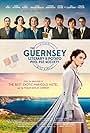 Tom Courtenay, Matthew Goode, Michiel Huisman, Penelope Wilton, Glen Powell, Katherine Parkinson, Jessica Brown Findlay, and Lily James in The Guernsey Literary and Potato Peel Pie Society (2018)