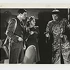Henry Brandon, Robert Kellard, and Luana Walters in Drums of Fu Manchu (1943)