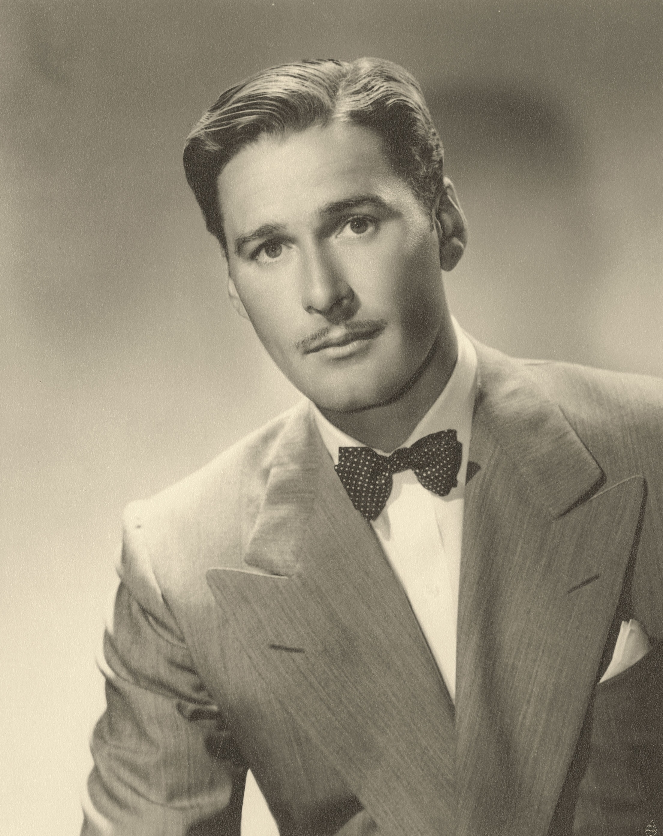 Errol Flynn in Four's a Crowd (1938)