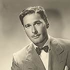 Errol Flynn in Four's a Crowd (1938)