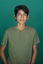 Teen boy in green shirt