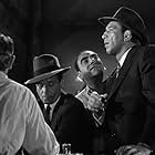 Ernie Adams, Mike Mazurki, Dick Powell, and Dewey Robinson in Murder, My Sweet (1944)