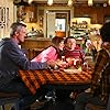 Patricia Heaton, Neil Flynn, Charlie McDermott, and Atticus Shaffer in The Middle (2009)