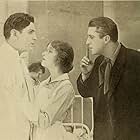 True Boardman, Mildred Harris, and Alan Roscoe in The Doctor and the Woman (1918)