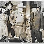 Ed Cassidy, Edward Howard, Lorraine Miller, and Bud Osborne in Three in the Saddle (1945)