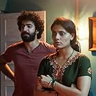 Saiyami Kher and Roshan Mathew in Choked (2020)