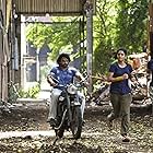 Madhavan, Ritika Singh, and Mumtaz Sorcar in Irudhi Suttru (2016)