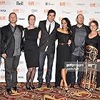 (L-R) Cinematographer Filip Dobosz, producer Rafi Spivak, photographer Noa Spivak, actor Paul Skrudland, actress Agam Darshi, director Bruce Sweeney, actress Gabrielle Rose and executive producer Kevin Eastwood attend the "Crimes of Mike Recket" premiere during the 2012 Toronto International Film Festival