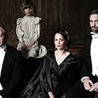 Bérénice Bejo, Liam Cunningham, Robert Pattinson, and Tom Sweet in The Childhood of a Leader (2015)