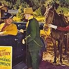 Gene Autry, Lon Chaney Jr., Tracy Layne, and Champion in The Singing Cowboy (1936)