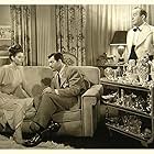 Ava Gardner, James Craig, and Frank Orth in She Went to the Races (1945)