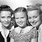 Louise Campbell, Joan Carroll, and Anne Shirley in Anne of Windy Poplars (1940)
