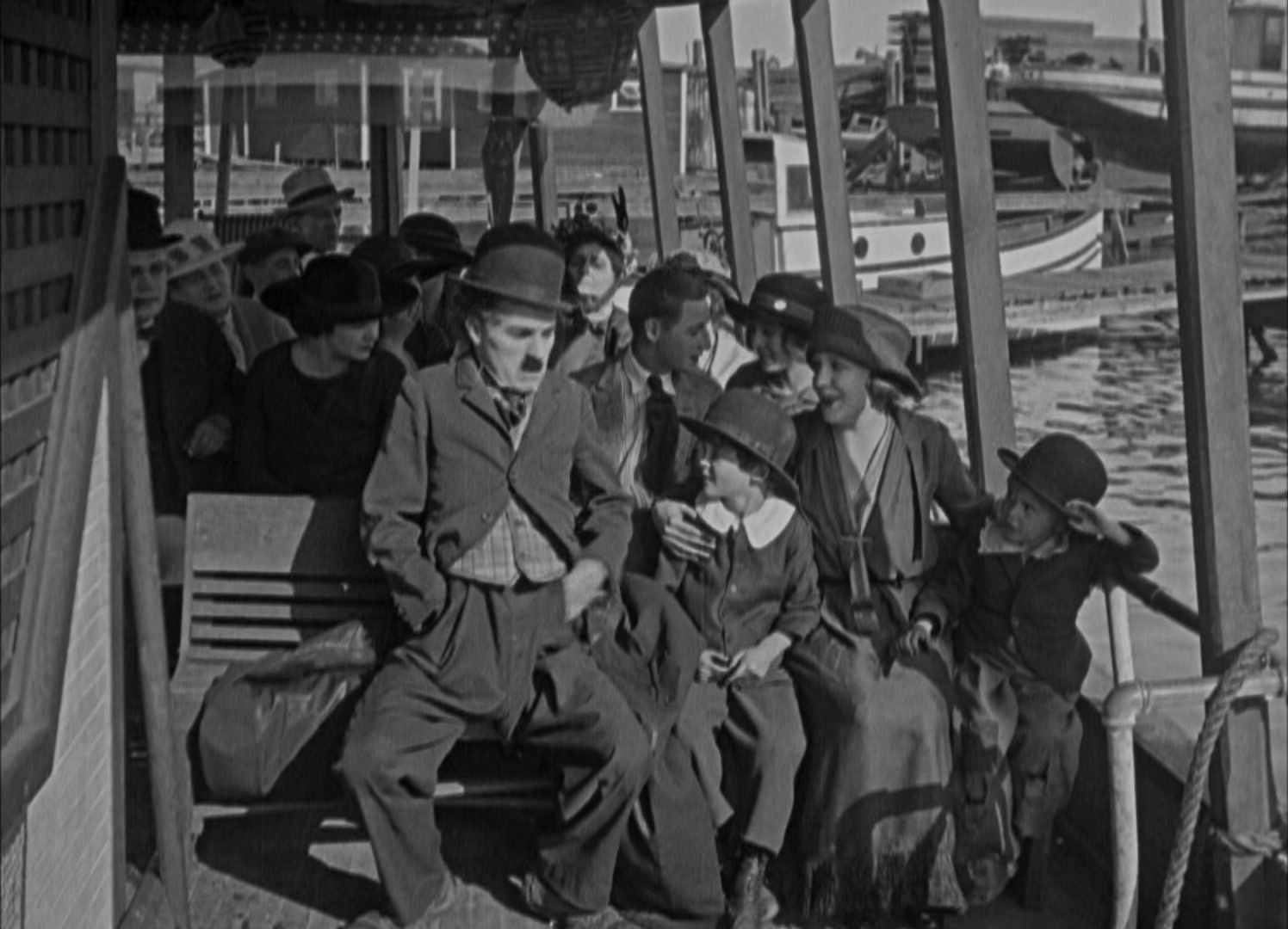 Charles Chaplin, Jackie Coogan, Elmer Ellsworth, Marion Feducha, Edna Purviance, and Arthur Thalasso in A Day's Pleasure (1919)