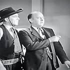 Ted Adams and Arthur Loft in Riders of Pasco Basin (1940)