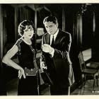 Billie Dove and Bryant Washburn in Try and Get It (1924)
