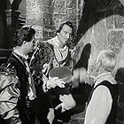 Laurence Olivier, Peter Cushing, and Norman Wooland in Hamlet (1948)