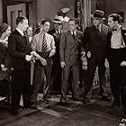 Mae Clarke, Wynne Gibson, Tom Kennedy, Jack Mulhall, Pat O'Malley, Alan Roscoe, and Ned Sparks in The Fall Guy (1930)