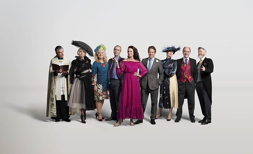 Rowan Atkinson, Kristin Scott Thomas, Hugh Grant, Andie MacDowell, John Hannah, Anna Chancellor, James Fleet, David Haig, and Sophie Thompson in One Red Nose and a Wedding (2019)