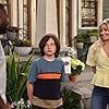 Sheaun McKinney, Beth Behrs, and Hank Greenspan in Welcome Back to the Neighborhood (2022)