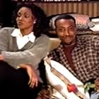 Vivica A. Fox and Arsenio Hall in Arsenio (1997)