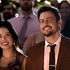 Tyler Hynes and Janel Parrish in Never Been Chris'd (2023)
