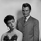 Jack Palance and Constance Smith in Man in the Attic (1953)