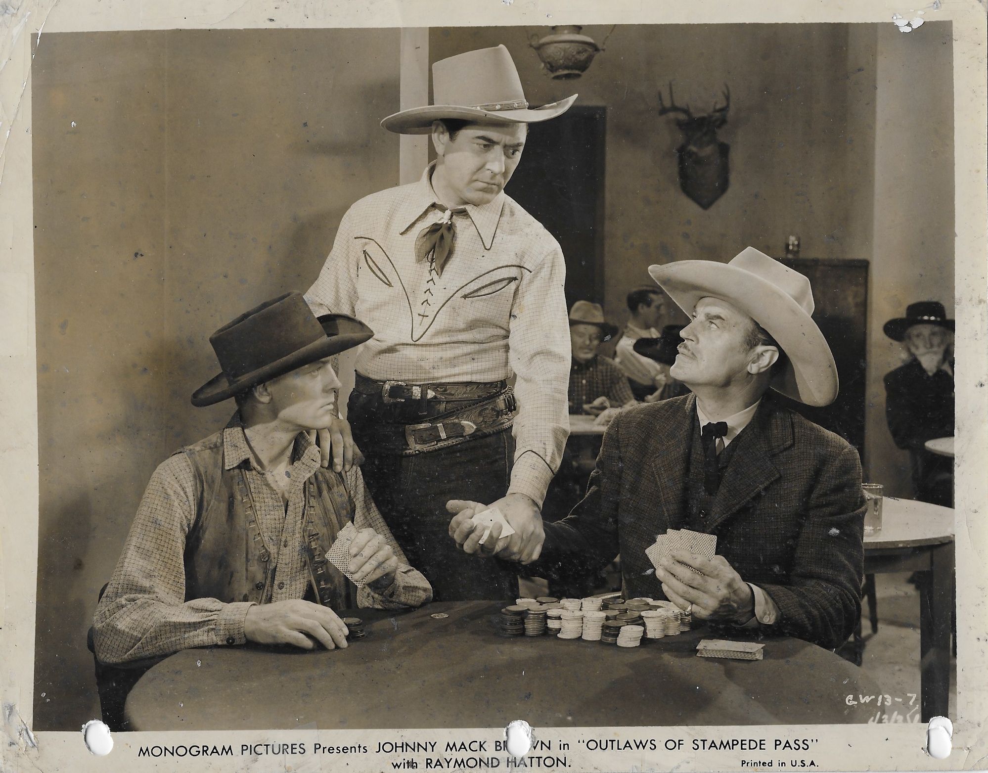 Johnny Mack Brown, Tex Cooper, John Dawson, and Harry Woods in Outlaws of Stampede Pass (1943)