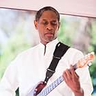 Tim Russ playing guitar