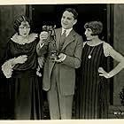 Rose Dione, Billie Dove, and Bryant Washburn in Try and Get It (1924)