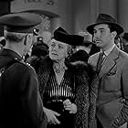 Lee Bowman, Selmer Jackson, and Nella Walker in Buck Privates (1941)