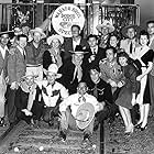 Humphrey Bogart, Errol Flynn, John Garfield, Alan Hale, Hoot Gibson, Buck Jones, Priscilla Lane, Rosemary Lane, Lya Lys, Frank McHugh, Wayne Morris, Jean Parker, John Payne, Frances Robinson, Gilbert Roland, Maxie Rosenbloom, Leon G. Turrou, Jack L. Warner, and Guinn 'Big Boy' Williams at an event for Dodge City (1939)