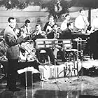 Glenn Miller, Trigger Alpert, Ray Anthony, Tex Beneke, Johnny Best, Ernie Caceres, Frank D'Annolfo, Ray Eberle, Al Klink, Jack Lathrop, Chummy MacGregor, Billy May, Dale McMickle, Jimmy Priddy, Moe Purtill, Wilbur Schwartz, Paul Tanner, and Glenn Miller and His Orchestra in Sun Valley Serenade (1941)