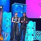 Fon Davis presenting at the Geekie Awards with Christina Wren.