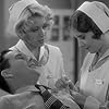 Joan Blondell, Barbara Stanwyck, and Ben Lyon in Night Nurse (1931)