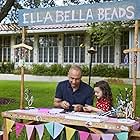 Derek Jeter and Ella Grace Helton talk and make Ella Bella Beads bracelets in a commercial for American Family Insurance. July 2019