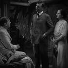 Beulah Bondi, Walter Huston, Kendall Lee, and Matt Moore in Rain (1932)