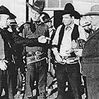 John Wayne, Yakima Canutt, Earl Dwire, and Lloyd Whitlock in The Lucky Texan (1934)