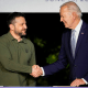Joe Biden shakes hands with Volodymyr Zelenskyy.