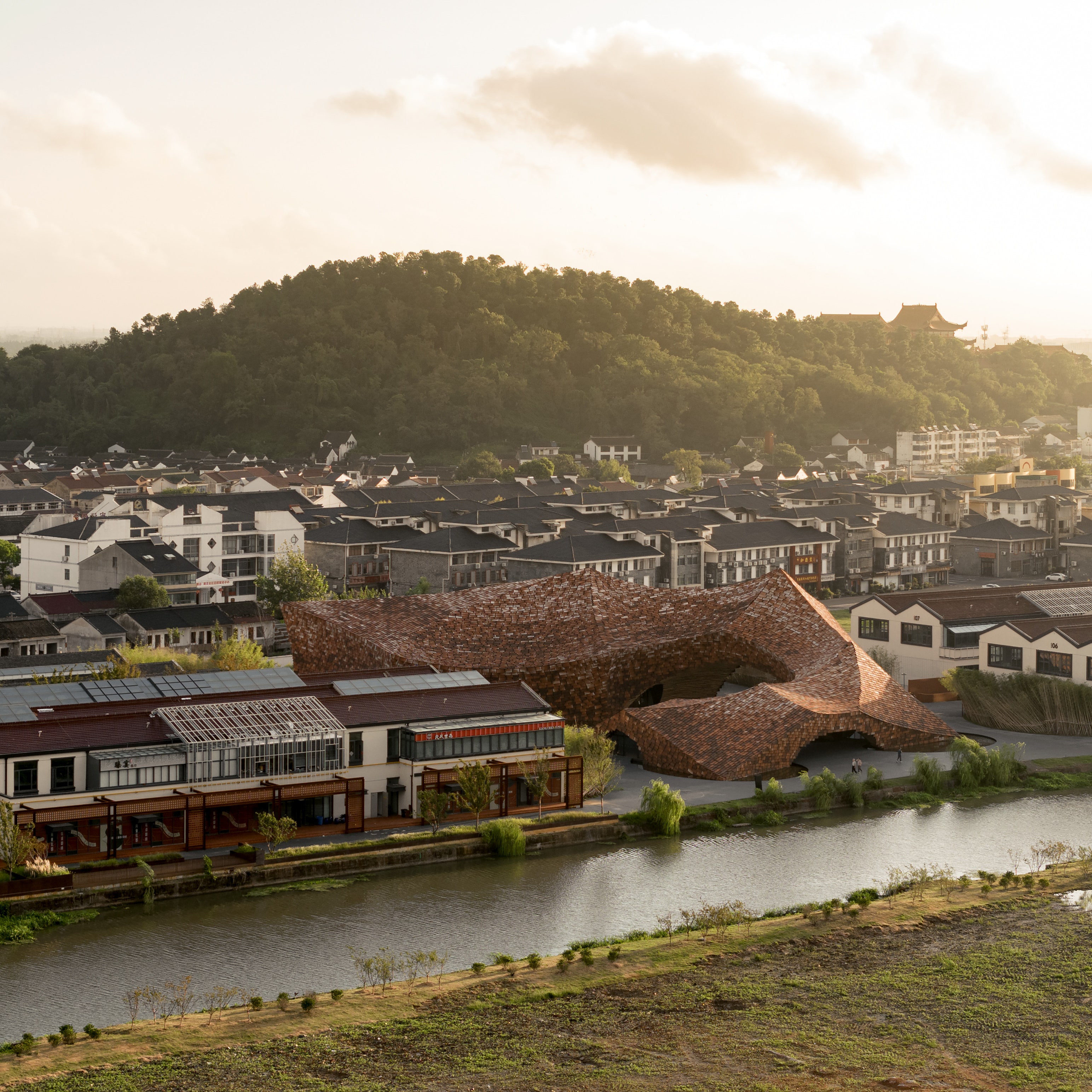 Kengo Kuma Completes a Monumental Building Clad in 3,600 Handmade Tiles