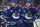 VANCOUVER, CANADA - APRIL 30: J.T. Miller #9 and Brock Boeser #6 of the Vancouver Canucks skate ups ice during Game Five of the First Round of the 2024 Stanley Cup Playoffs against the Nashville Predators at Rogers Arena on April 30, 2024 in Vancouver, British Columbia, Canada.  (Photo by Jeff Vinnick/NHLI via Getty Images)