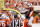 AUSTIN, TEXAS - SEPTEMBER 02: Quinn Ewers #3 of the Texas Longhorns is congratulated by teammates after a rushing touchdown in the third quarter against the Rice Owls at Darrell K Royal-Texas Memorial Stadium on September 02, 2023 in Austin, Texas. (Photo by Tim Warner/Getty Images)