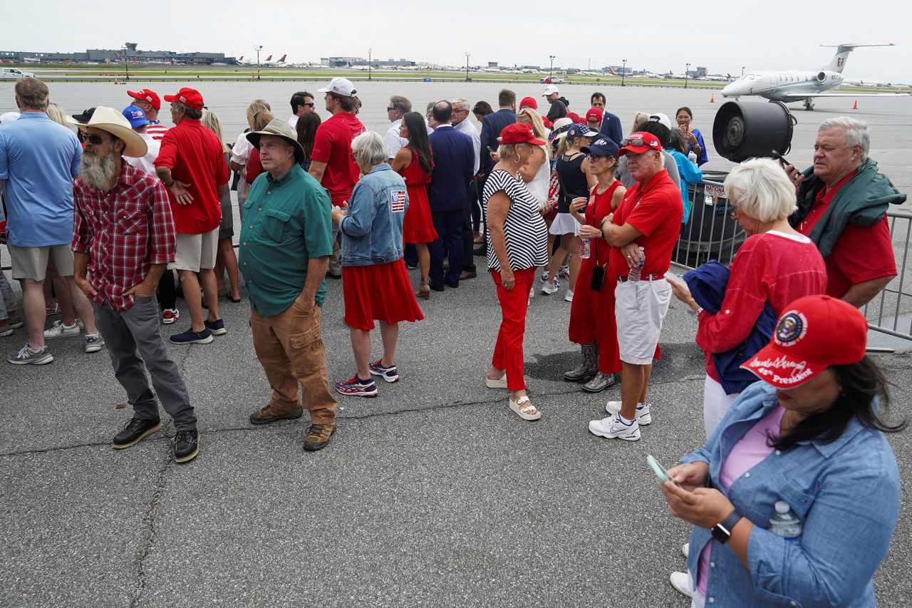 Supporters of former President Donald Trump await his arrival at Hartsfield-Jackson Airport in Atlanta for the CNN Presidential Debate with President Joe Biden on Thursday.