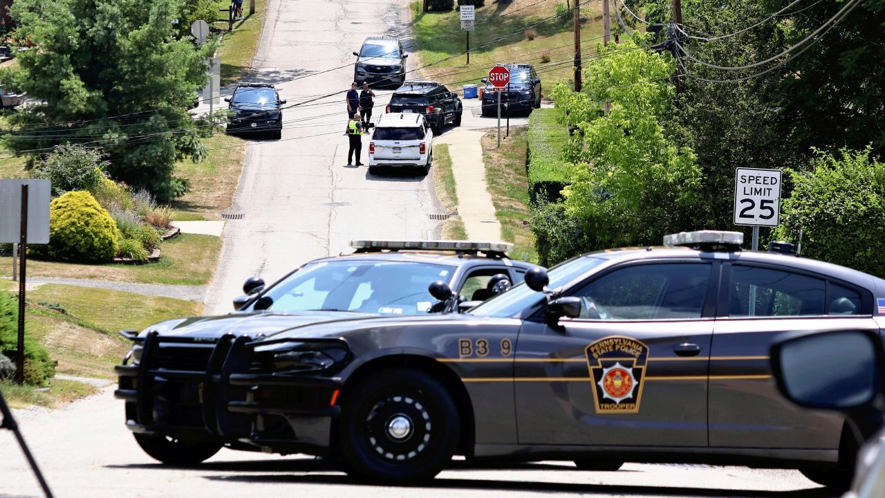 Police vehicles are seen around the house of Thomas Matthew Crooks in Bethel Park, Pennsylvania, on July 14, 2024.