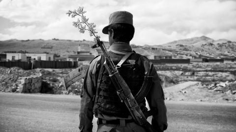 An Afghan National Police officer mans a checkpoint in the outskirts of Maidan Shahr, Wardak province, Wednesday, May 15, 2013. The National Police and Army are providing security unaided by international troops now in most of Afghanistan. (AP Photo/Anja Niedringhaus)
