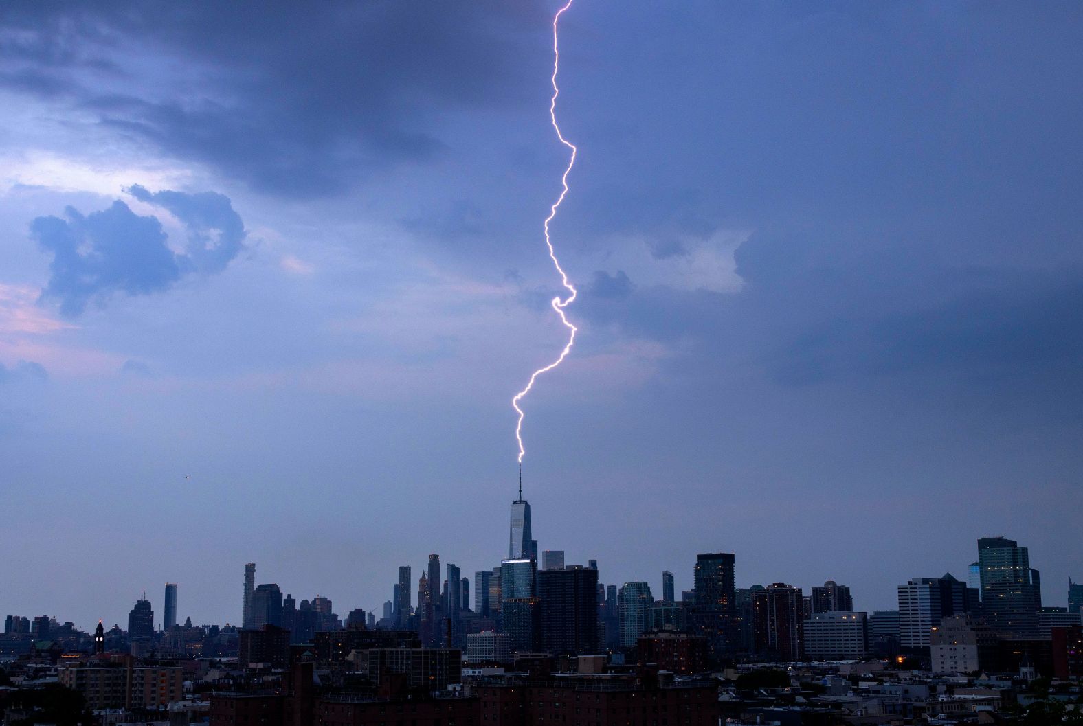 A lightning bolt strikes One World Trade Center during a thunderstorm in New York on Saturday, June 22.