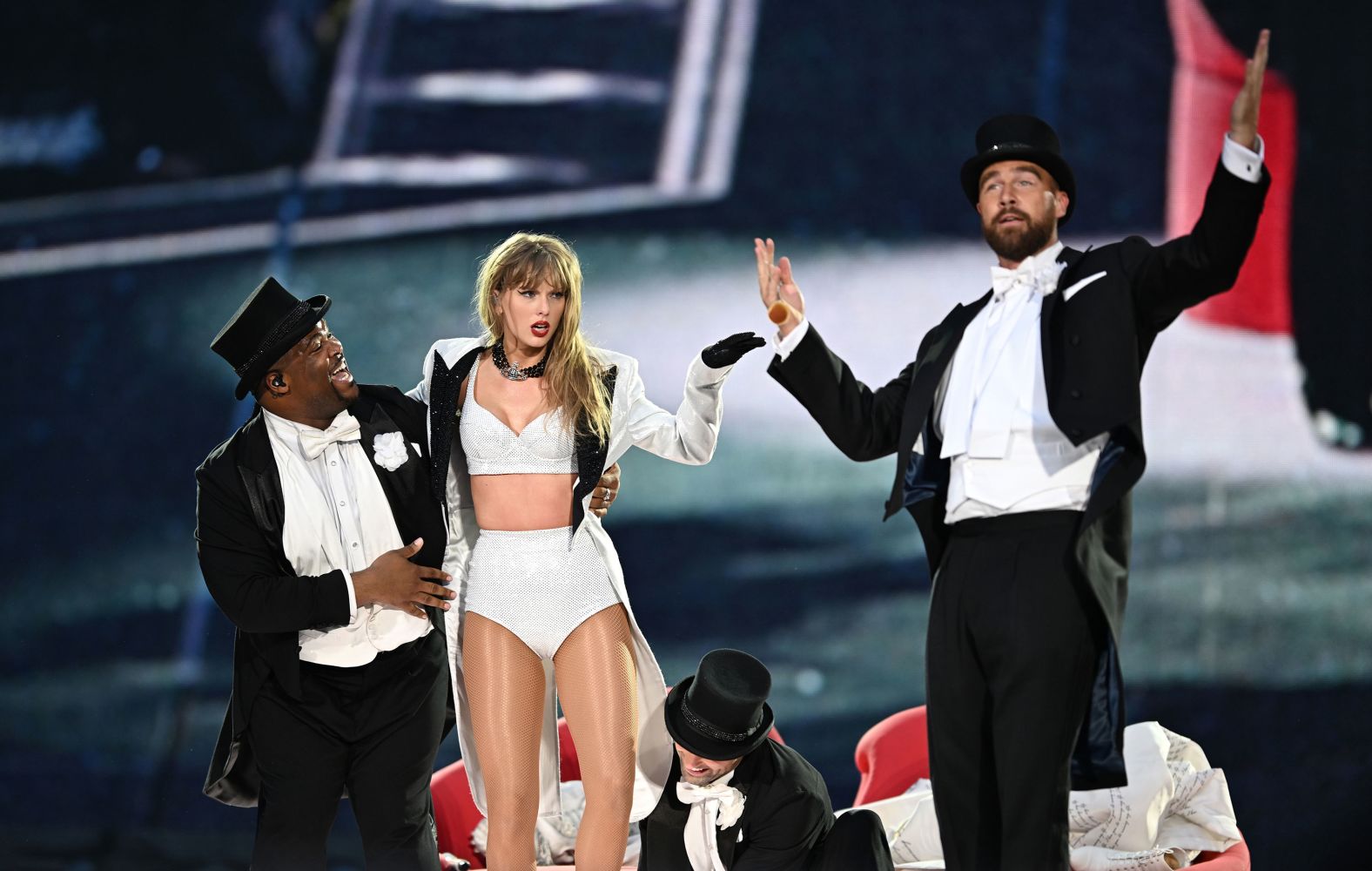 Football star Travis Kelce, right, appears on stage with his girlfriend, Taylor Swift, during her concert at London’s Wembley Stadium on Sunday, June 23. <a href="https://www.cnn.com/2024/06/23/entertainment/taylor-swift-travis-kelce-on-stage/index.html">His big moment</a> came during a transition in the “Tortured Poets Department” segment of Swift’s setlist. <a href="http://www.cnn.com/2023/08/04/entertainment/gallery/taylor-swift-eras-tour/index.html">See more photos from Swift's "Eras Tour."</a>