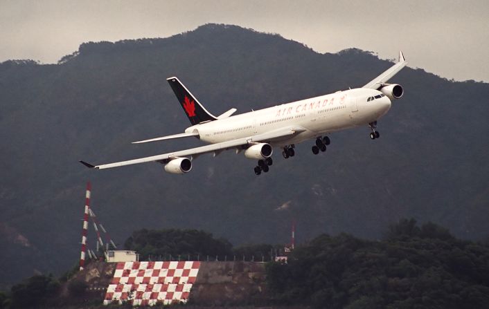 <strong>Checkerboard Hill: </strong>In the background is the famous Checkerboard Hill. The orange and white checkerboard served as a visual signal for pilots to begin the turn for the runway. The maneuver became known as the "checkerboard turn."